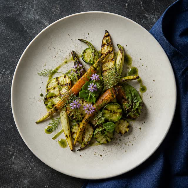 Plated signature dish on the digital menu